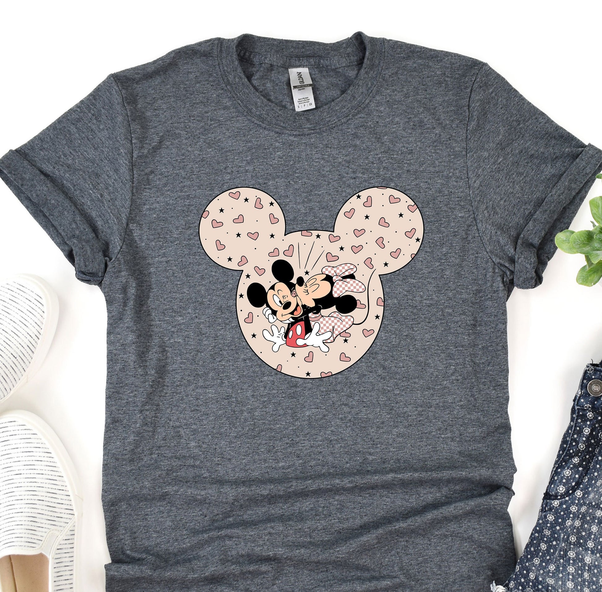 a mickey mouse t - shirt sitting on top of a table