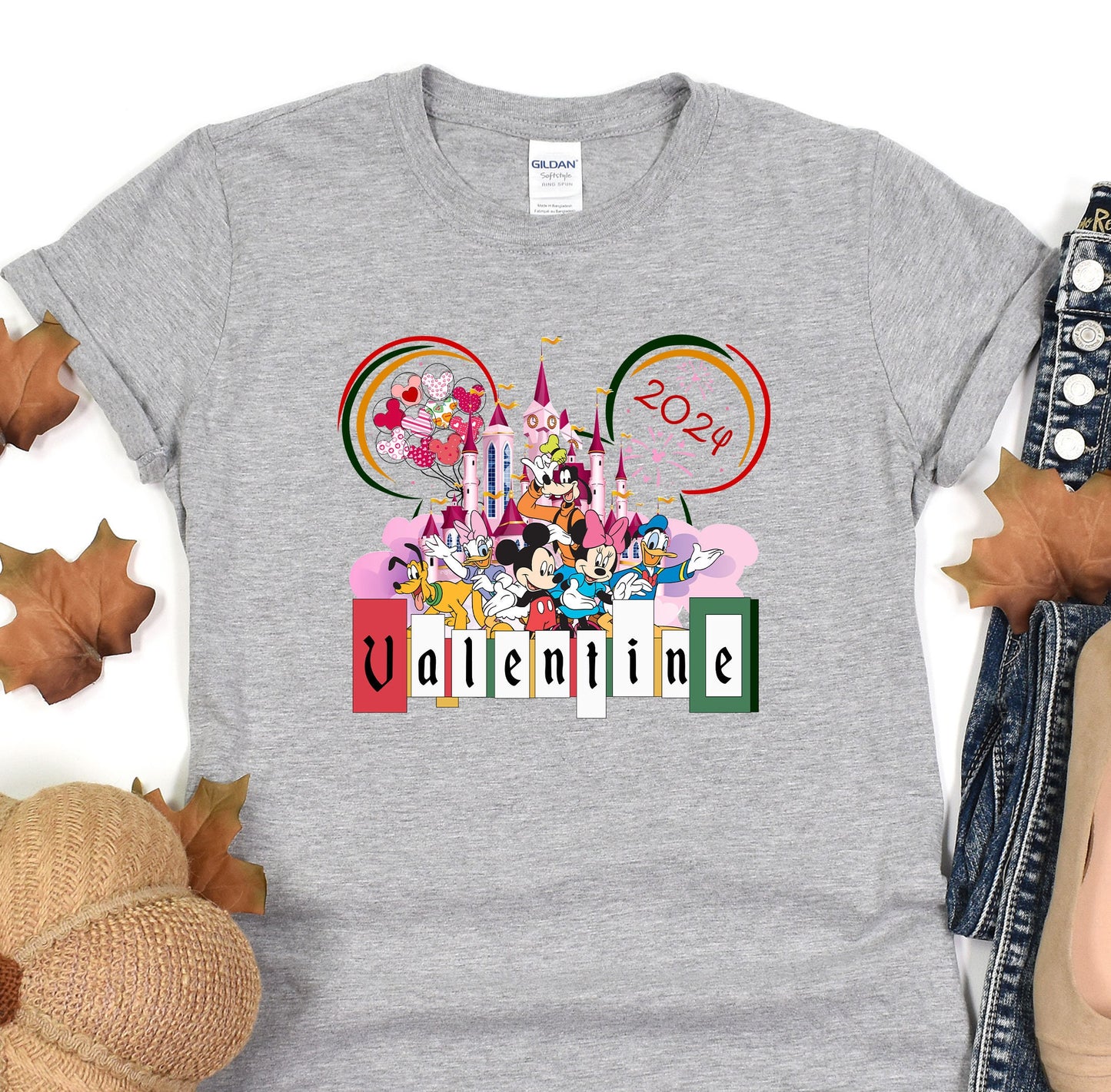 a mickey mouse t - shirt with the word disney on it