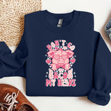 a blue sweatshirt with a pink pig on it
