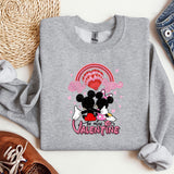 a sweater with a mickey and minnie mouse on it