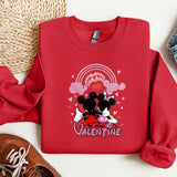 a red sweatshirt with a mickey mouse graphic on it