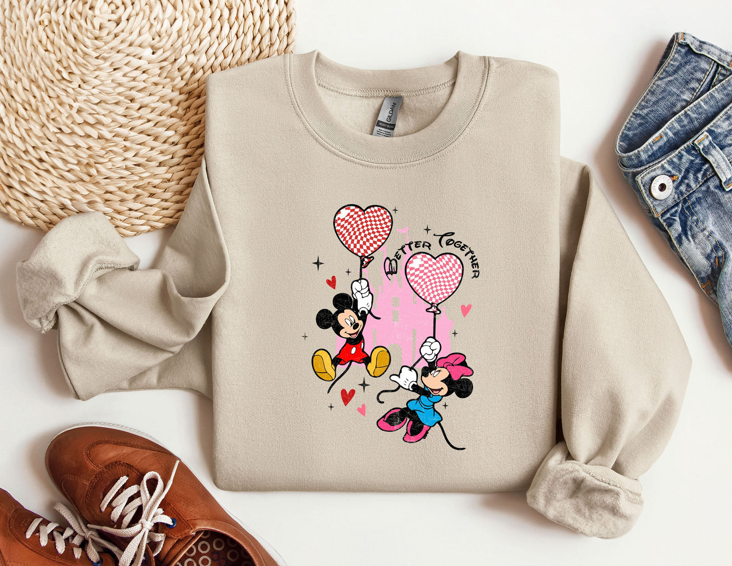 a sweater with a mickey mouse and minnie mouse on it