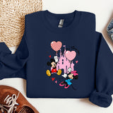 a blue sweatshirt with mickey mouse and minnie mouse on it