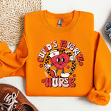 a pair of shoes and an orange shirt on a white surface