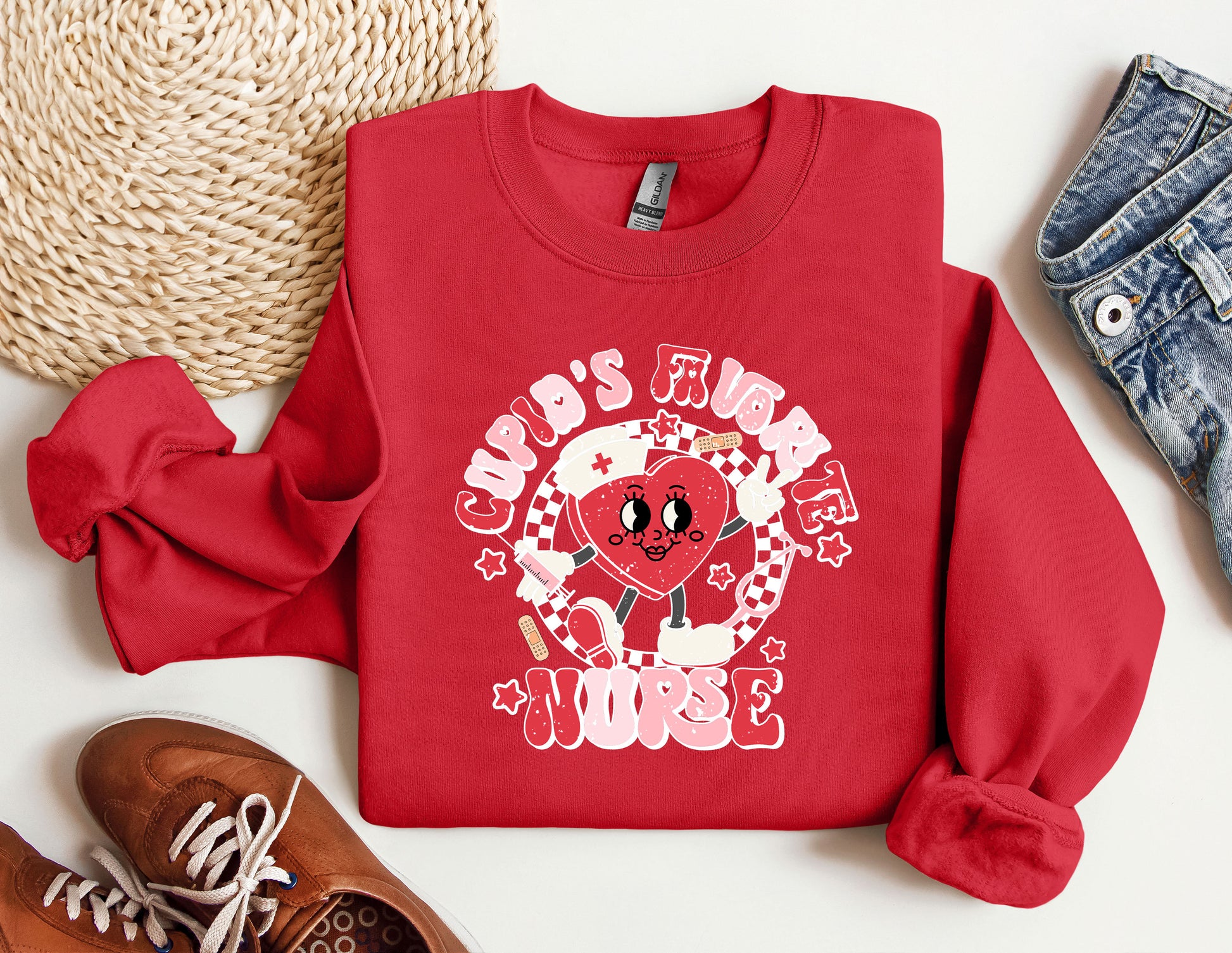 a red sweatshirt with a cartoon character on it