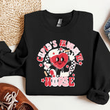 a black sweatshirt with a red heart on it