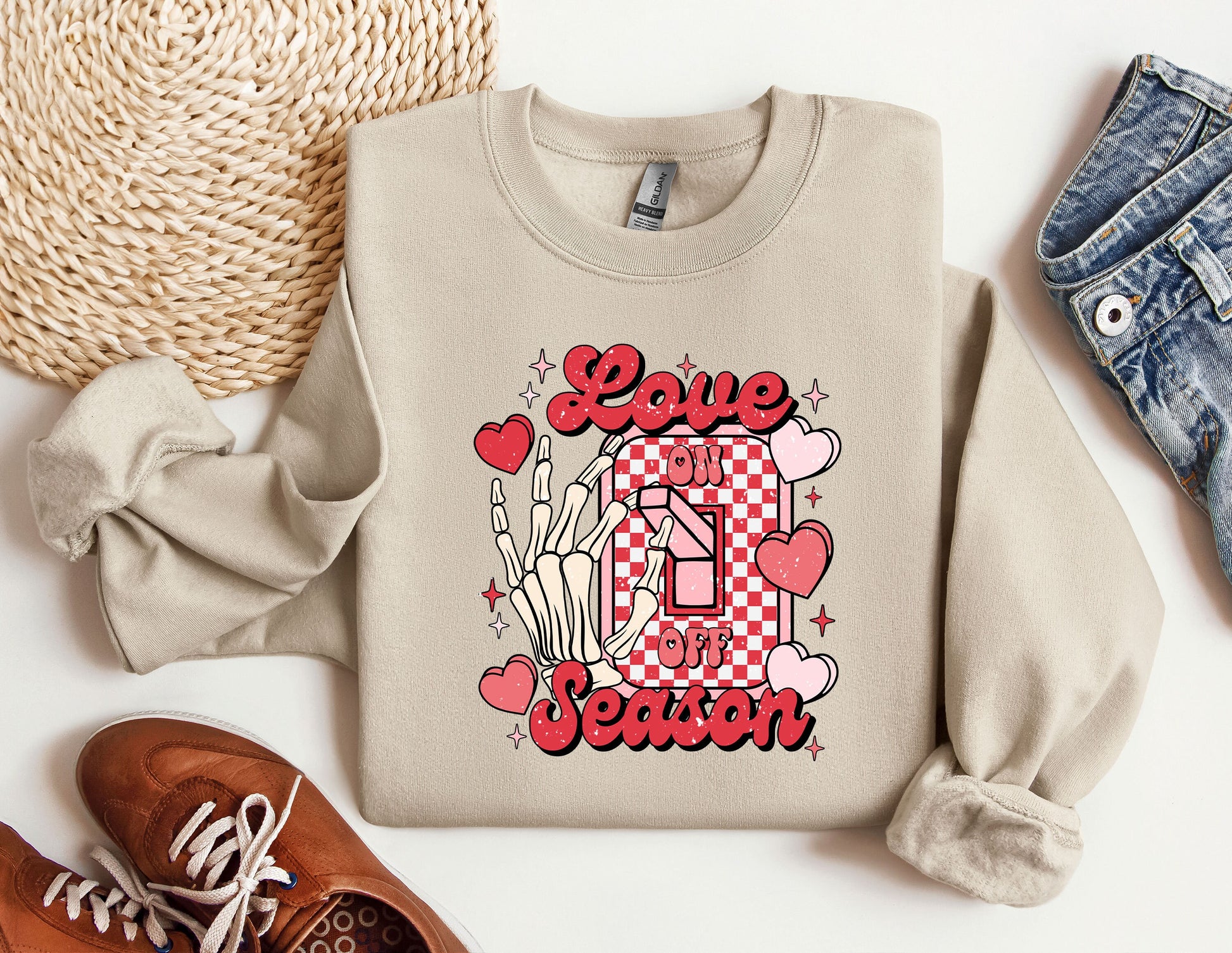 a pair of shoes and a sweater with the word love is in the center