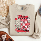 a pair of shoes and a sweater with the word love is in the center