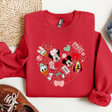 a red sweatshirt with mickey and minnie mouses on it