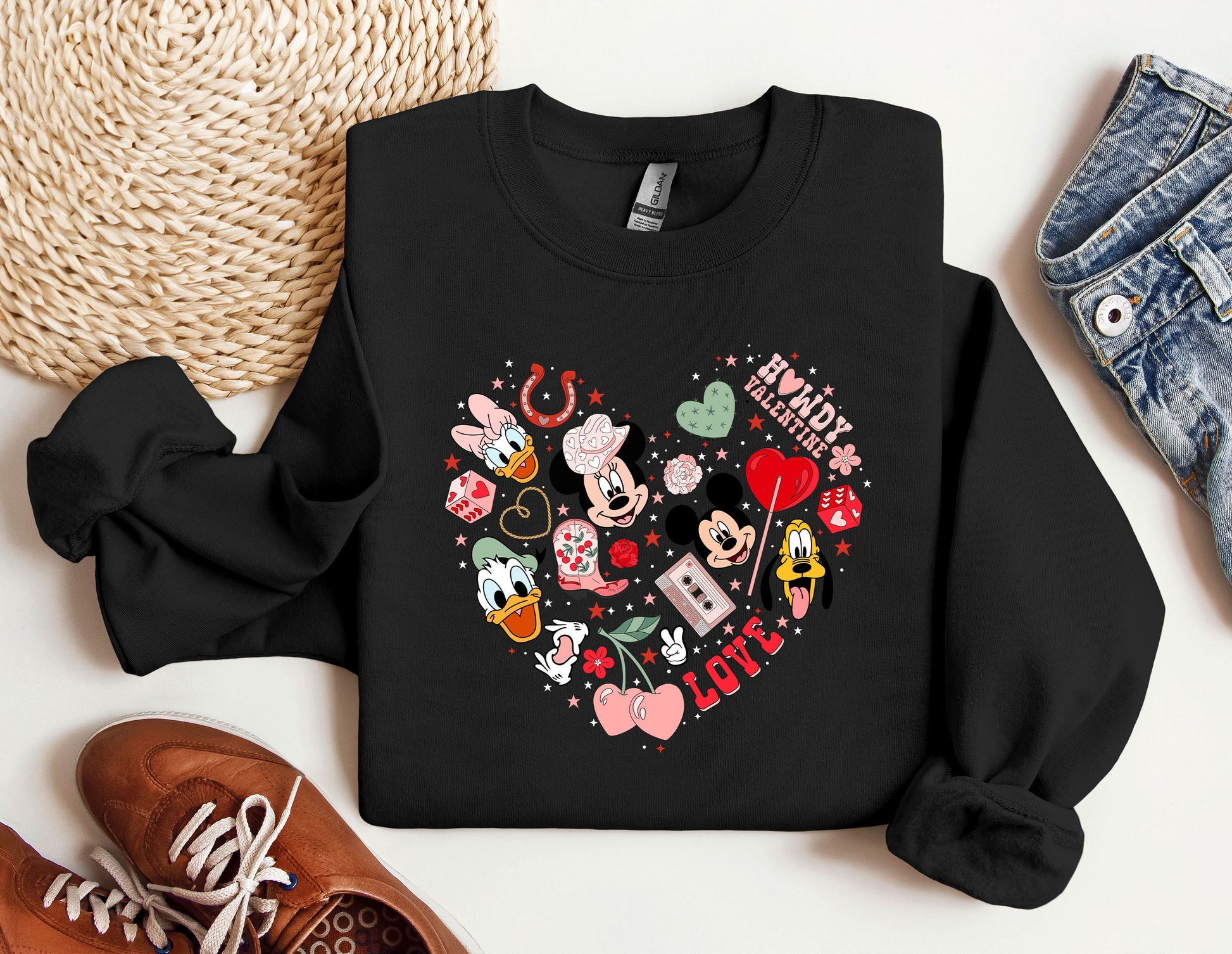 a black sweatshirt with mickey mouse and minnie mouse hearts