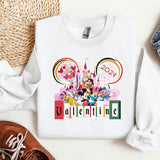 a mickey mouse sweatshirt with a pair of shoes next to it