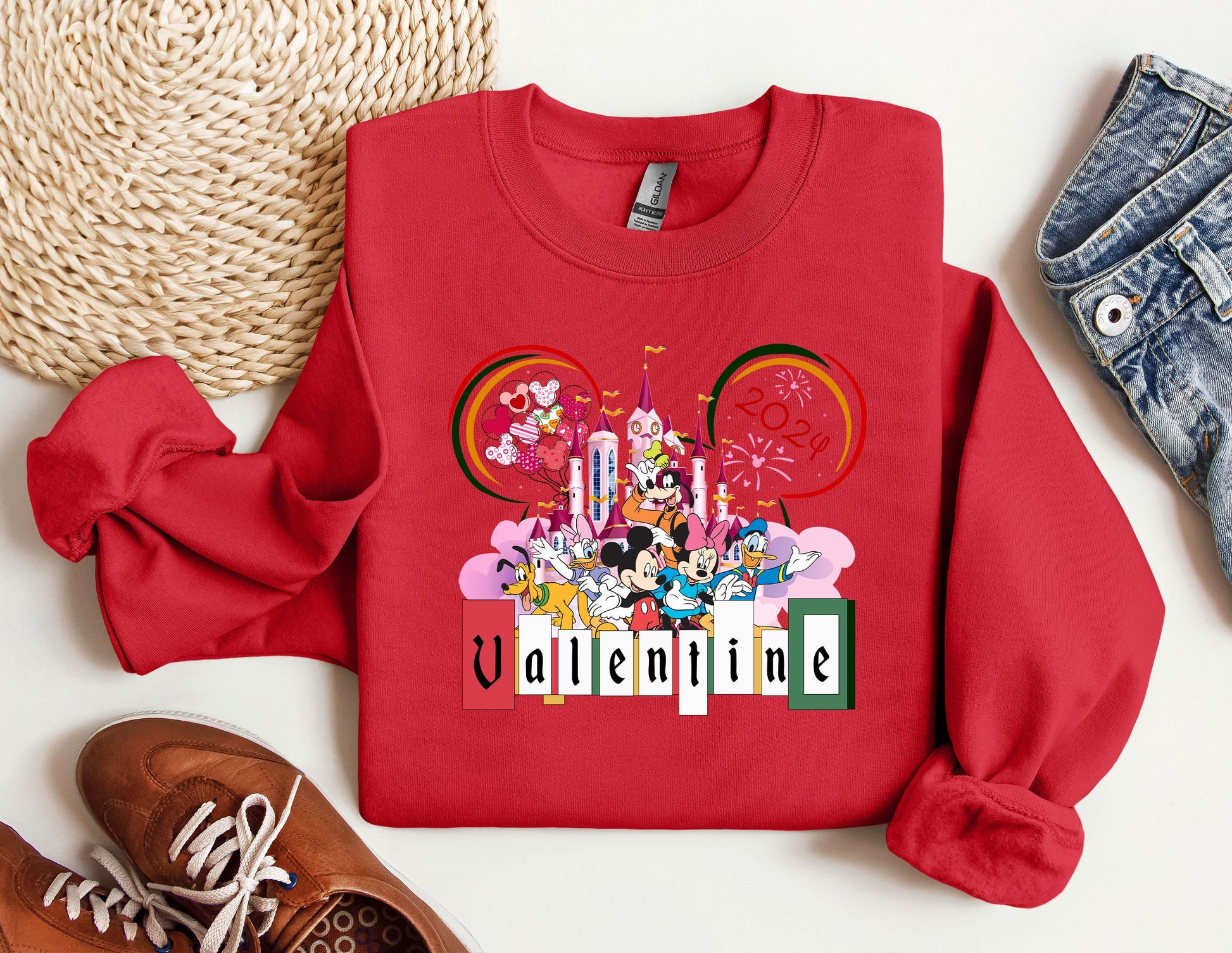 a red sweatshirt with mickey mouse on it