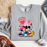 a sweatshirt with a mickey and minnie mouse on it