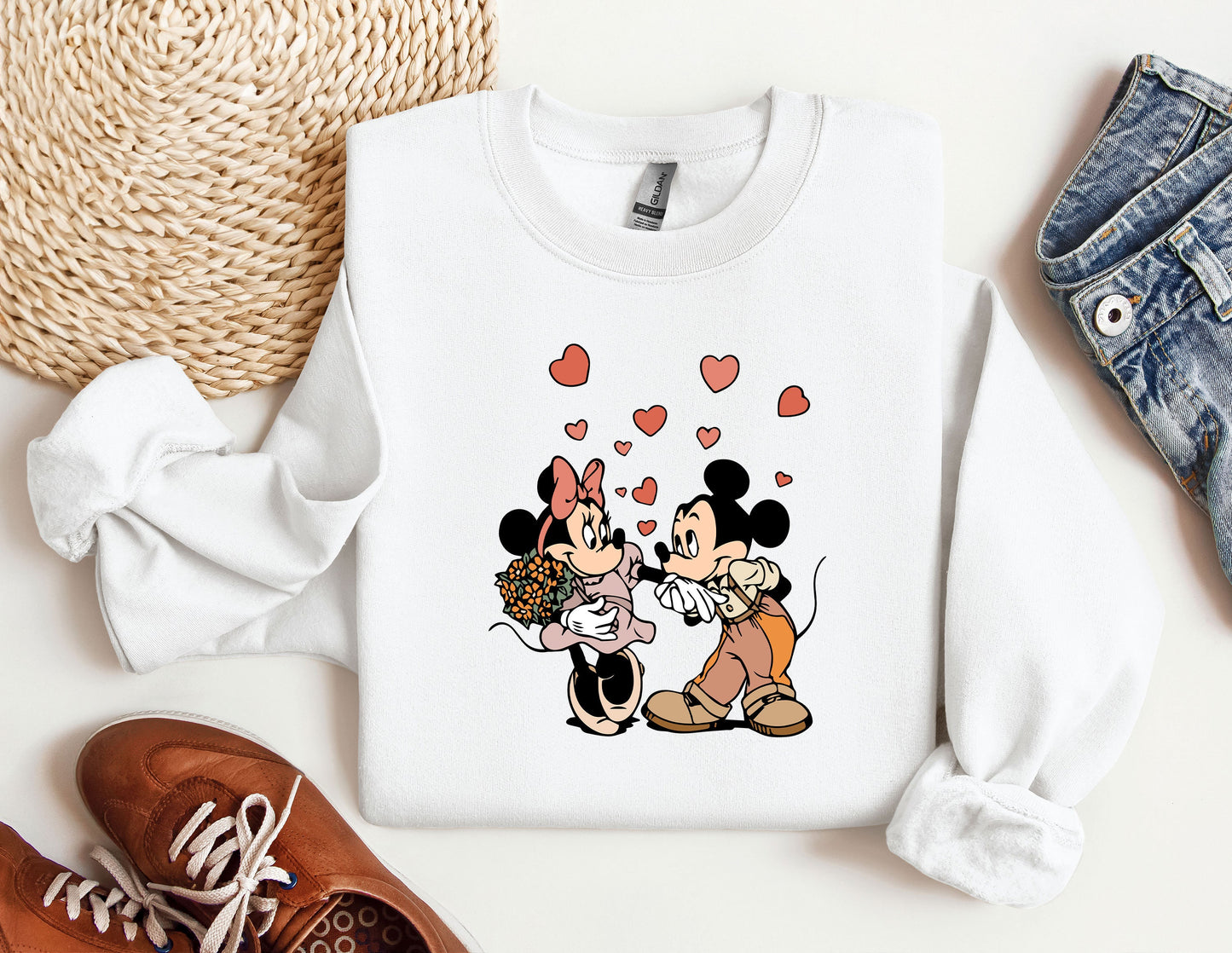 a couple of mickey and minnie mouse shirts