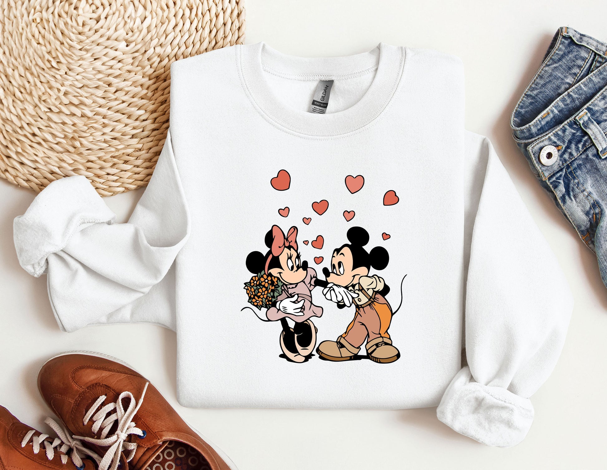 a couple of mickey and minnie mouse shirts
