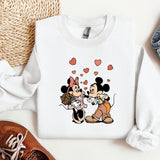 a couple of mickey and minnie mouse shirts