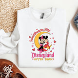 a white shirt with a mickey mouse on it