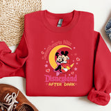 a red sweatshirt with a mickey mouse on it