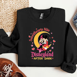 a black sweatshirt with a mickey mouse on it