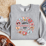 a gray sweatshirt with hearts and mickey mouses on it
