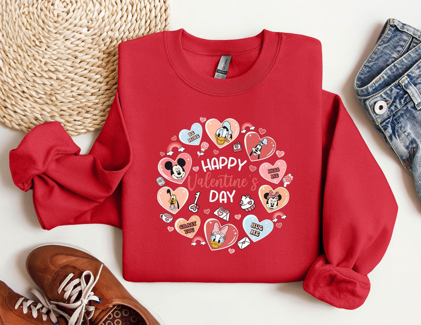 a red shirt with a heart and mickey mouses on it