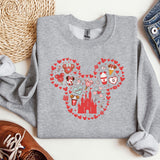 a gray sweatshirt with a mickey mouse design on it