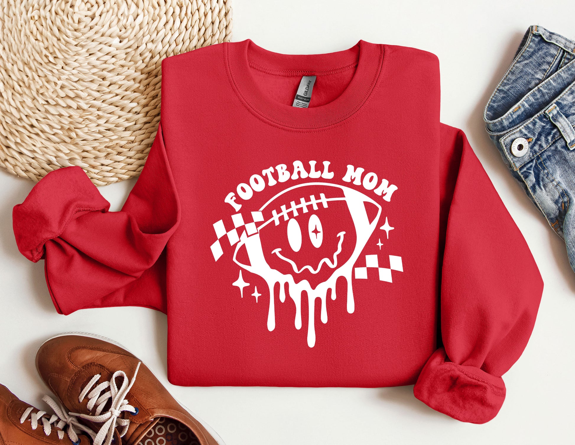 a red sweatshirt with a football mom on it