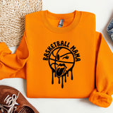 an orange sweatshirt with a basketball drawn on it