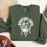 a green sweatshirt with a basketball drawn on it