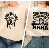 a woman wearing a sweatshirt with the words basketball mama on it