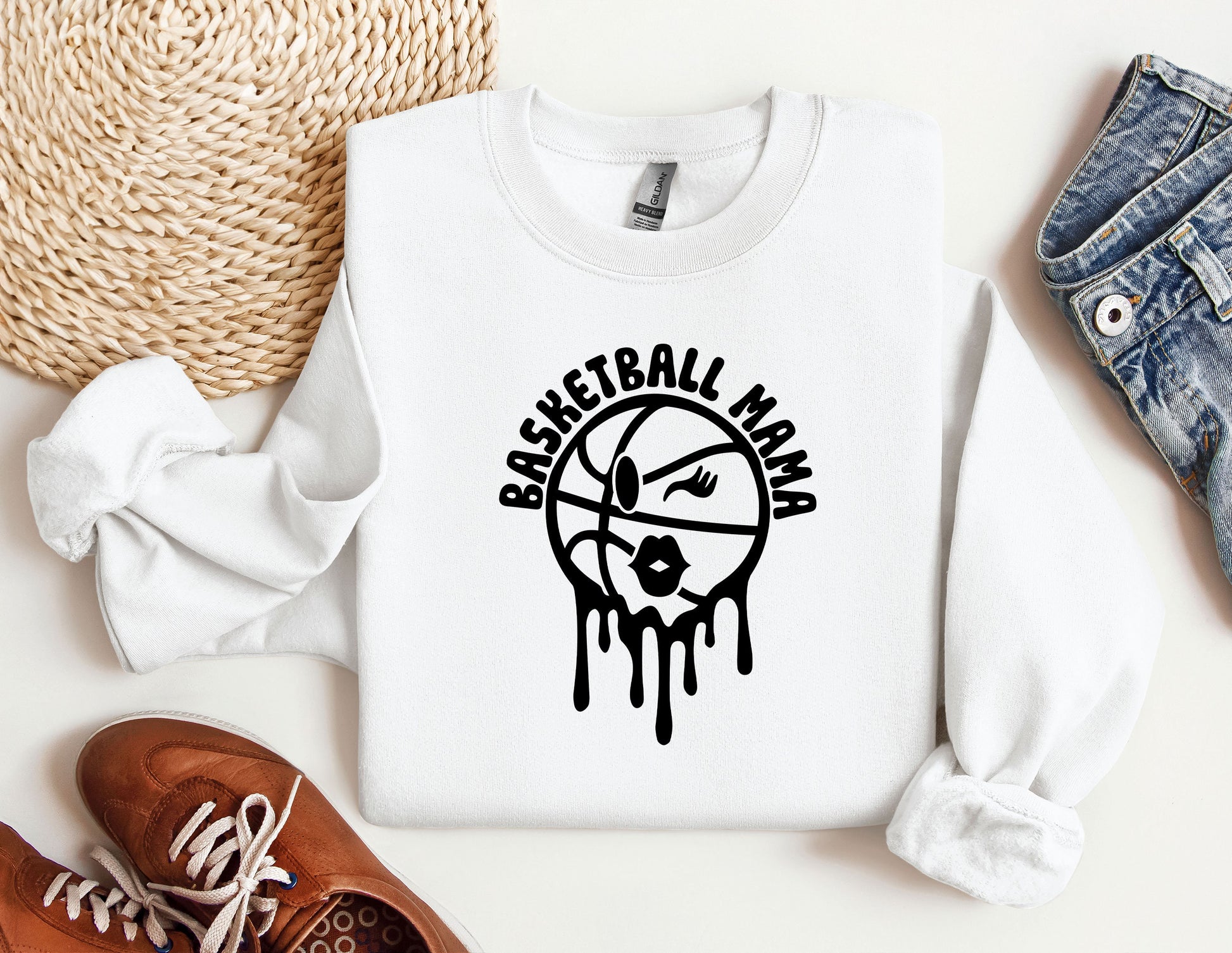 a white sweatshirt with a basketball design on it