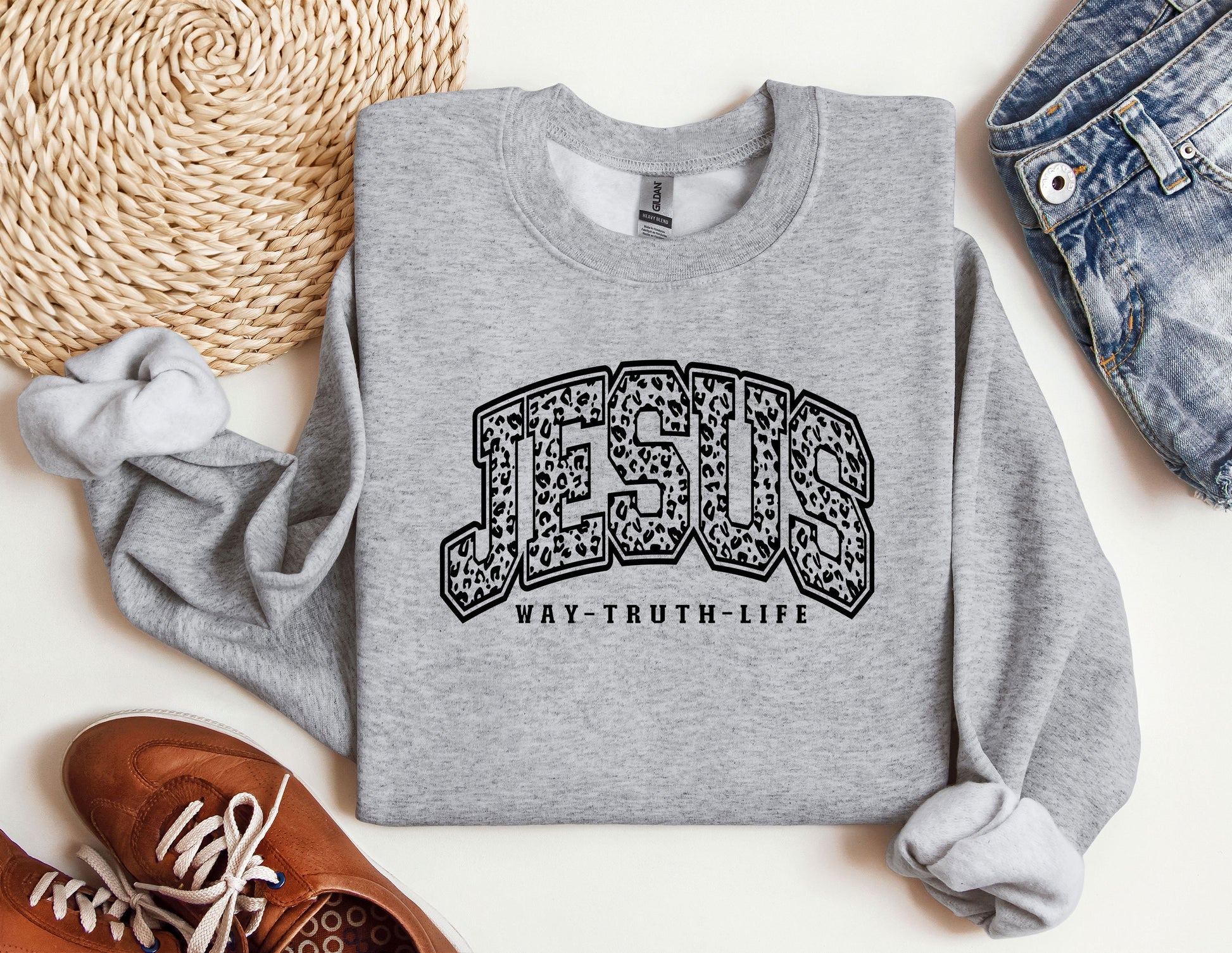 a sweatshirt with the word jesus on it