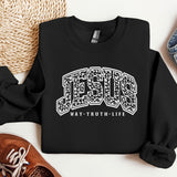 a black sweatshirt with the word jesus on it
