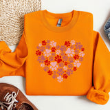 a pair of shoes and a sweater on a white surface
