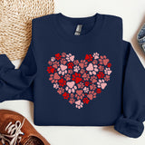 a blue sweatshirt with a heart made out of paw prints