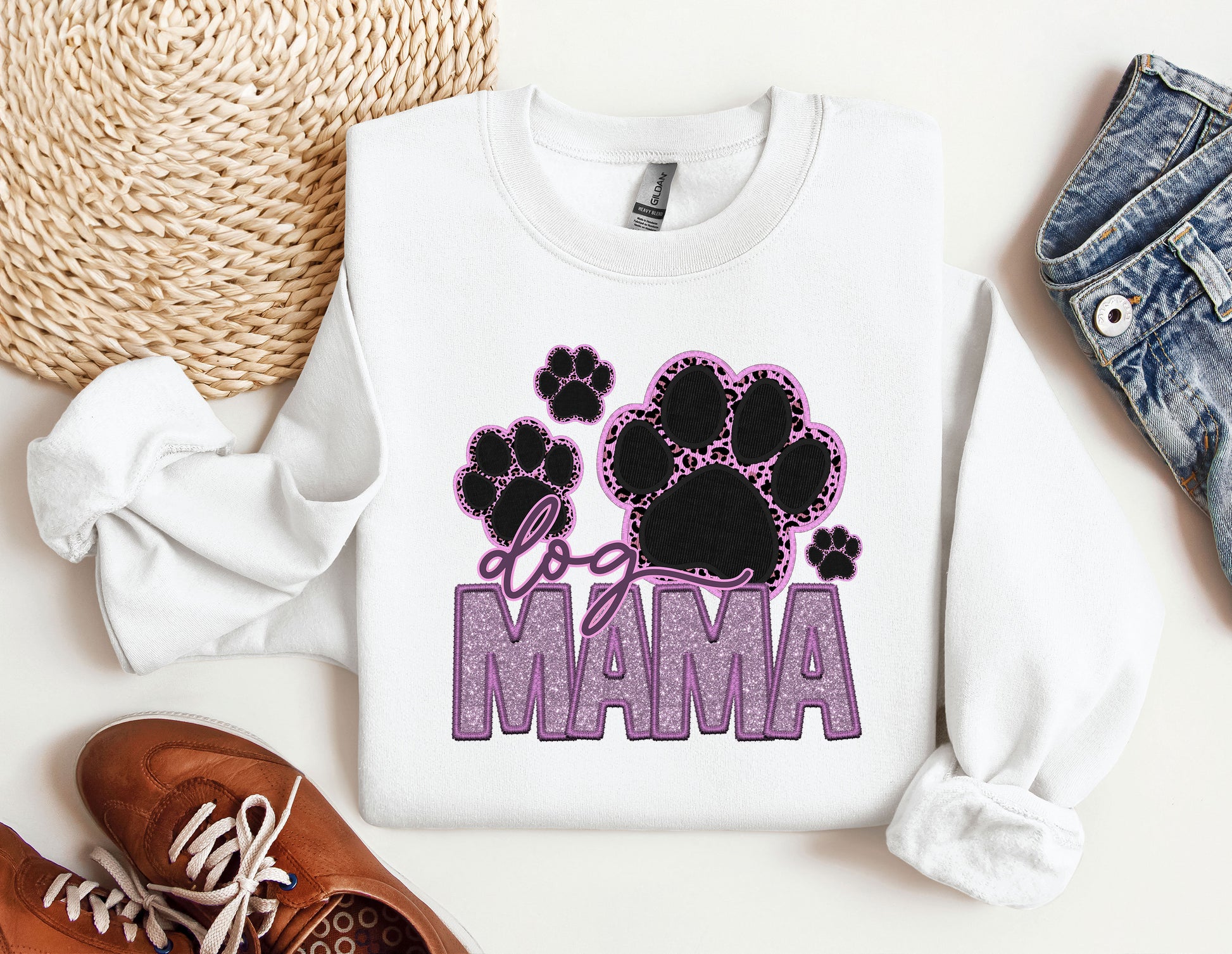 a pair of shoes and a sweatshirt with the word mama printed on it