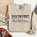 a pair of shoes and a sweater on a table
