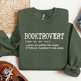 a green sweatshirt that says booktrover next to a pair of shoes
