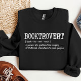 a black shirt with a poem on it next to a pair of shoes