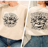 a woman wearing a sweatshirt with a graphic on it