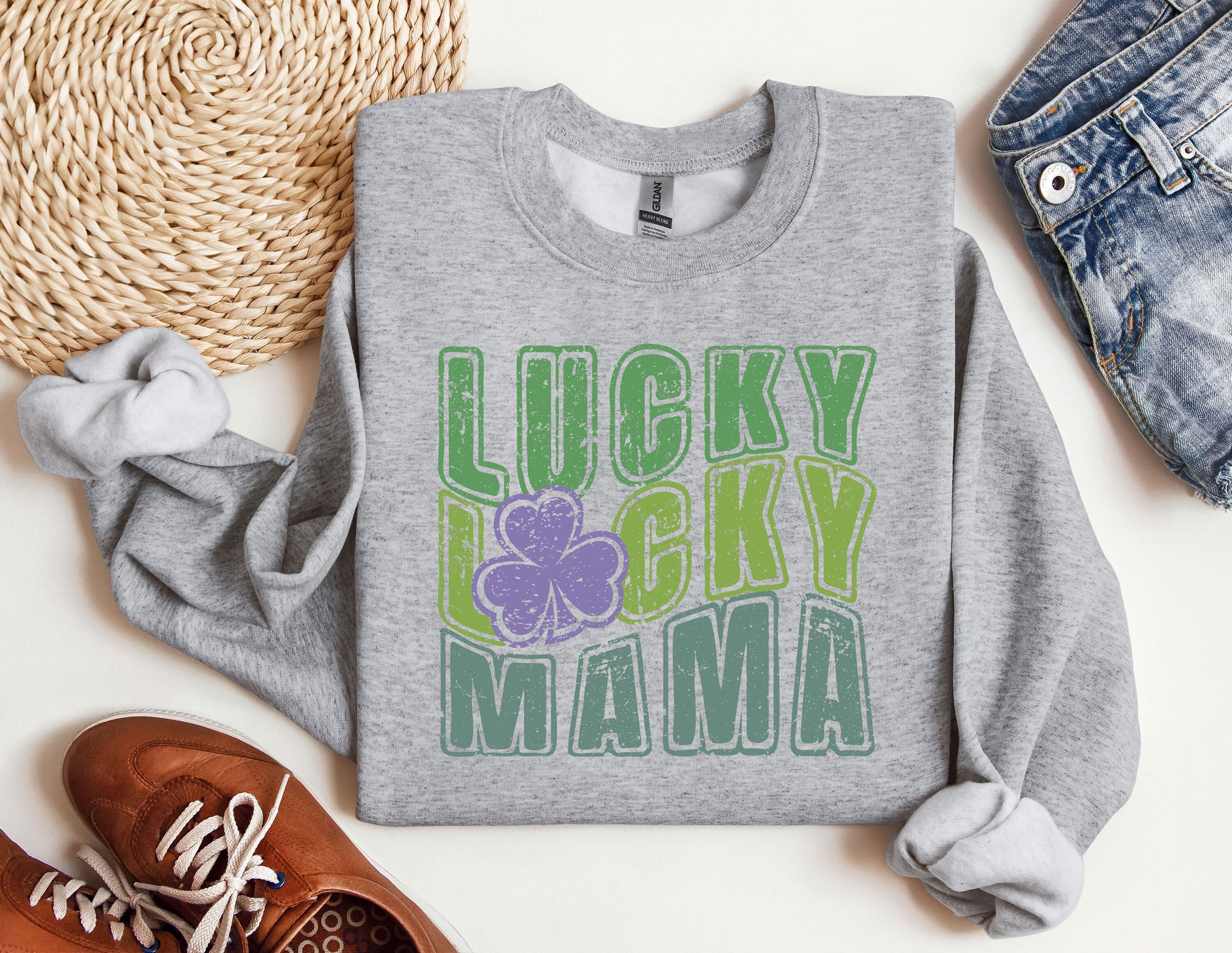 a sweater that says lucky lucky mama on it