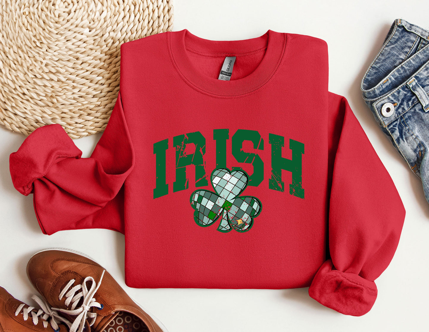 a red sweatshirt with a shamrock on it