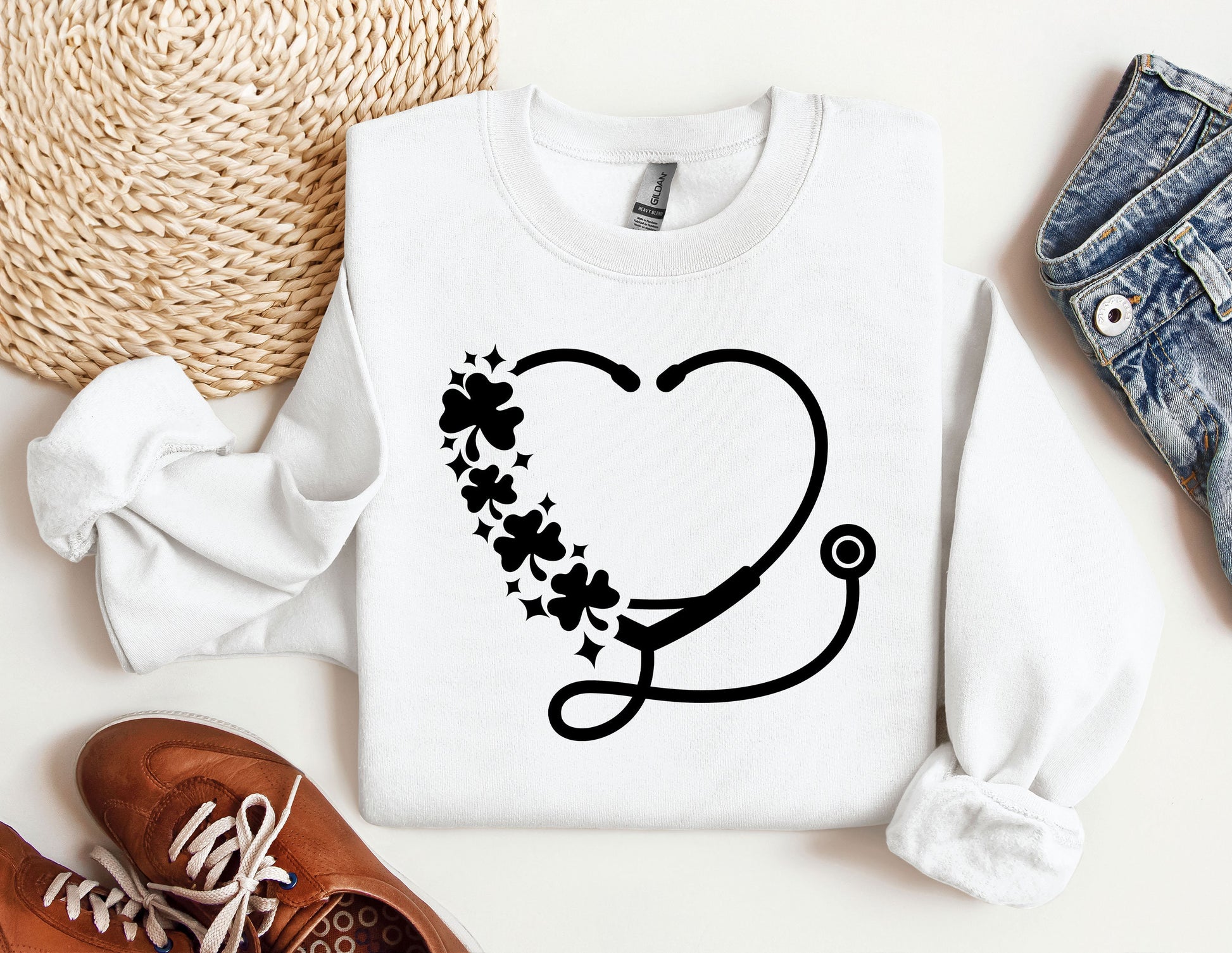a sweater with a stethoscope and flowers on it