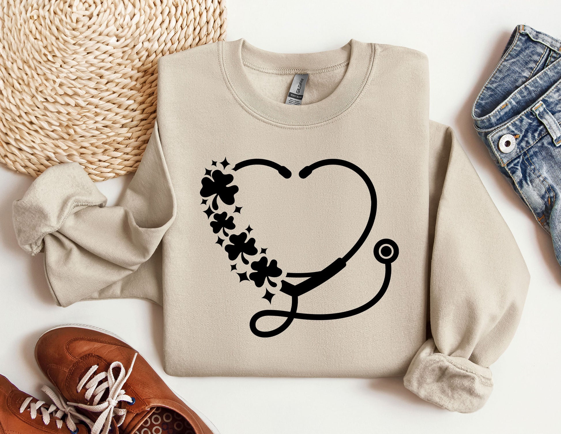 a sweater with a stethoscope and flowers on it