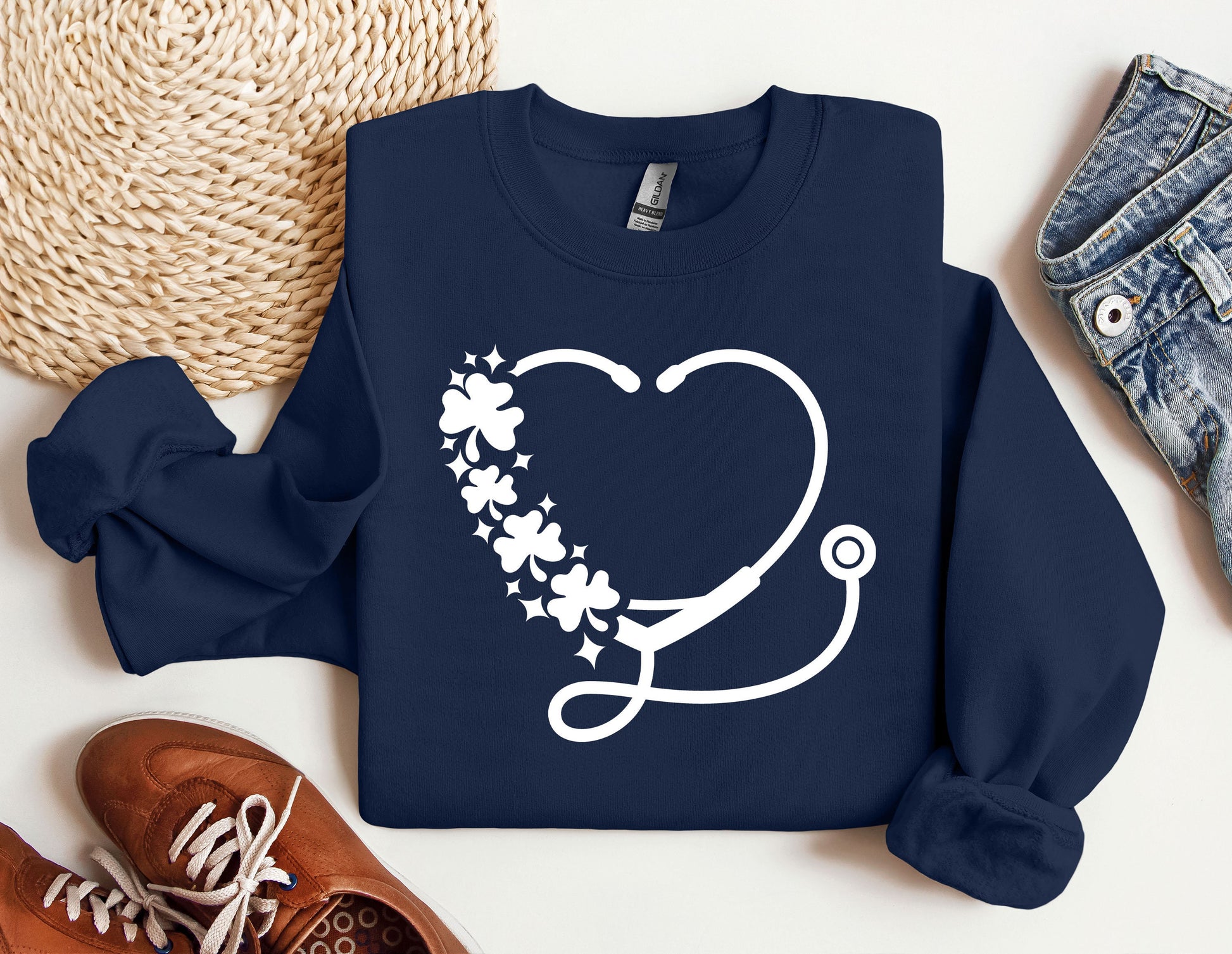 a sweater with a stethoscope and flowers on it