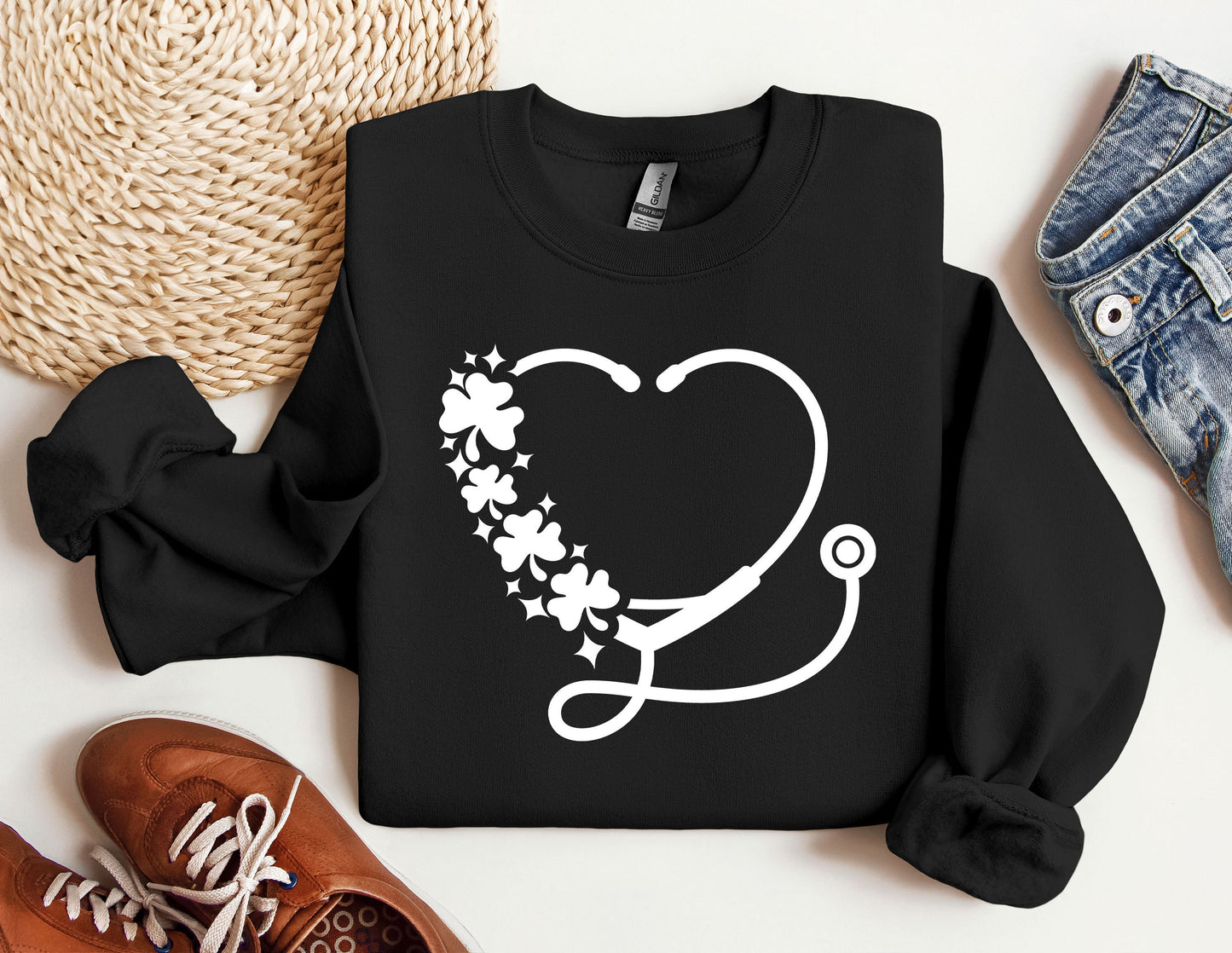 a sweater with a stethoscope and flowers on it