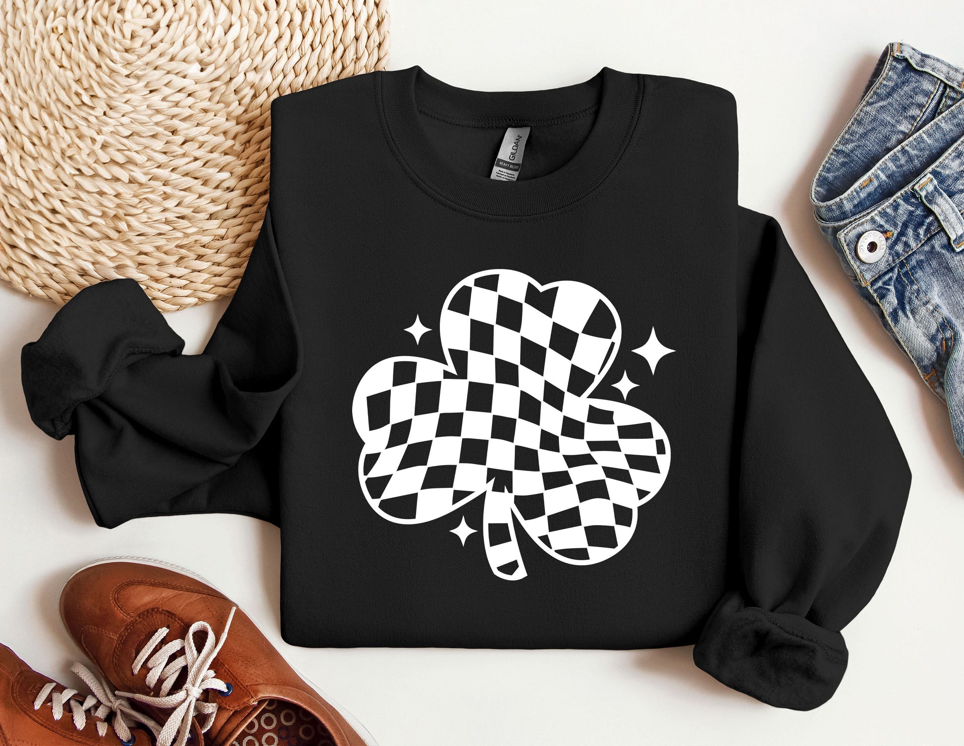 a sweater with a four leaf clover on it