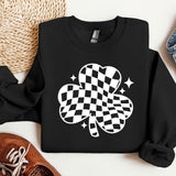 a sweater with a four leaf clover on it