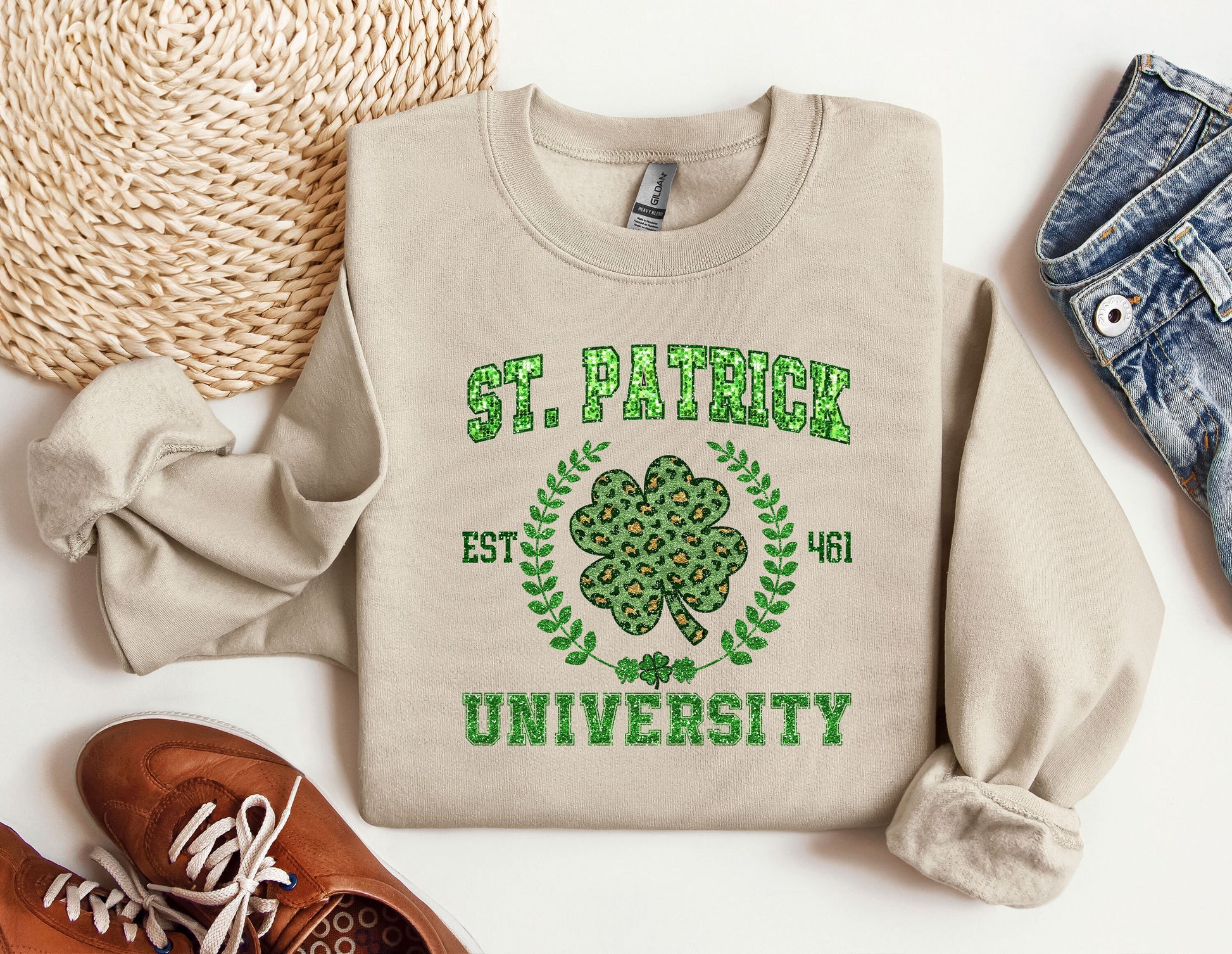 a st patrick&#39;s sweatshirt with a shamrock on it next to a pair of