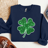 a blue sweater with a green shamrock on it